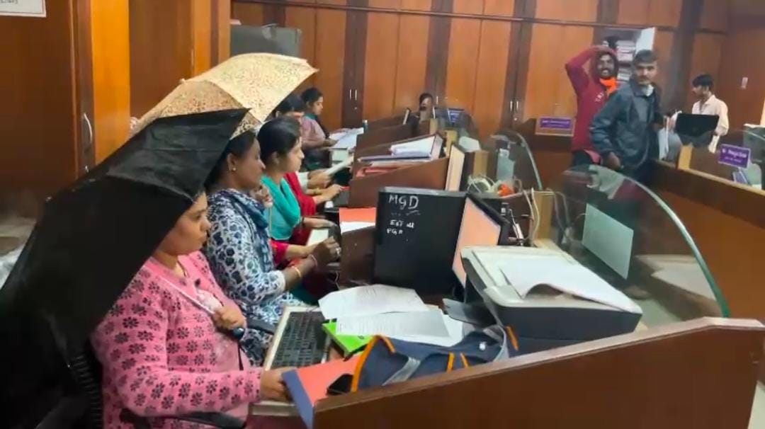 Photos of Govt officials using umbrellas inside Haveri office go viral